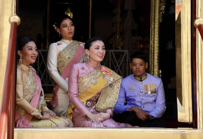 The king's daughters Princess Bajrakitiyabha and Princess Sirivannavari Nariratana, Queen Suthida and the king's son Prince Dipangkorn Rasmijoti (L to R), during the monarch's coronation ceremony at the Grand Palace in Bangkok, Thailand, yesterday. 