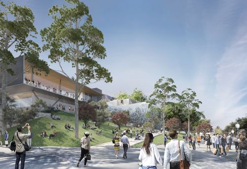 The design includes grassy space and tree-lined paths that lead out to the Yarra River.

