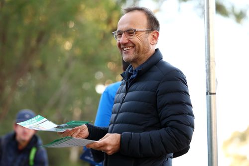 MELBOURNE, AUSTRALIA - MAY 03: Adam Bandt, leader of the Greens greets voters in the seat of Wills at Brunswick East Primary School on May 03, 2025 in Melbourne, Australia. Australians headed to the polls on Saturday for the 2025 federal election, where all 150 seats in the House of Representatives and 40 of 76 Senate seats are up for grabs. This election is especially consequential due to a tightly contested race, with cost-of-living pressures, affordable housing, and energy policy dominating t