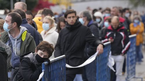 People wait to be vaccinated against COVID-19 in Zagreb, Croatia as countries throughout Central and Eastern Europe reported spiralling coronavirus cases. 