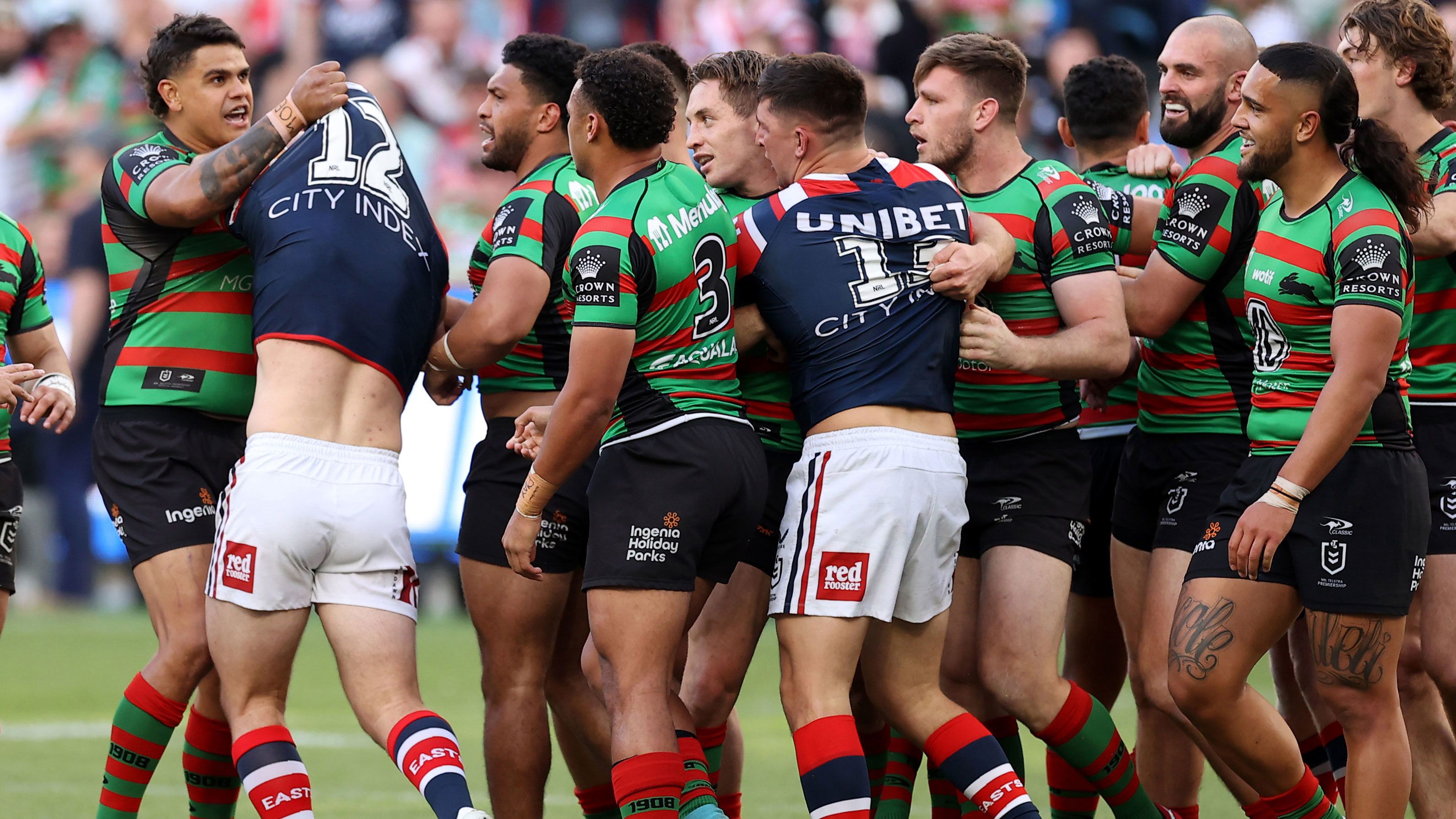 Latrell Mitchell of the Rabbitohs scuffles with Nat Butcher of the Roosters during their 2022 NRL elimination final.