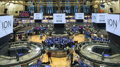 In this photo provided by the New York Stock Exchange, traders work on the floor during the listing of ION Acquisition Corp 1 Ltd., from Israel, Friday, October 2, 2020