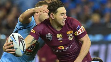 Billy Slater tries to get a ball away during Game II of State of Origin. (AAP)