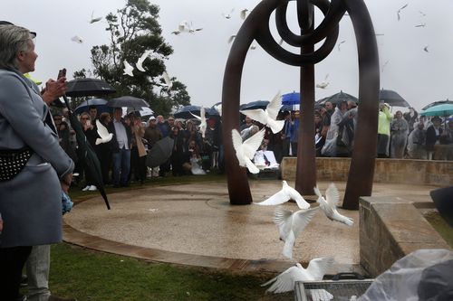 Eighty-eight doves are released, one for each Australian who died in the 2002 Bali bombings
