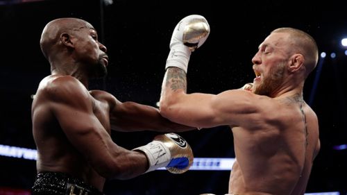 Floyd Mayweather has defeated Conor McGregor in the 10th round of their fight in Las Vegas. (AAP)
