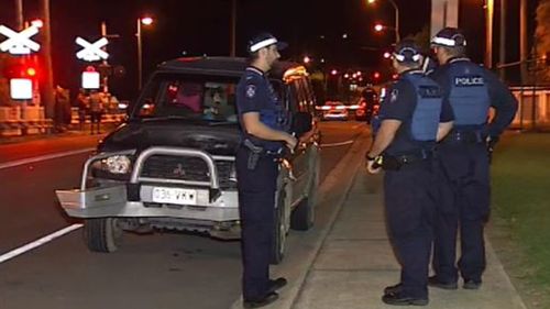 It's believed the man was hit after he ran around a lowered boom gate while being chased. (9NEWS)