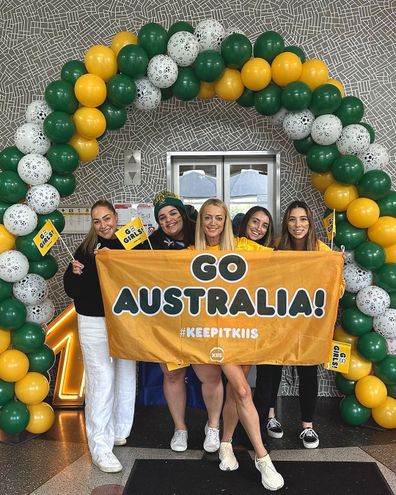 Jackie O posed with a banner for the Aussie side