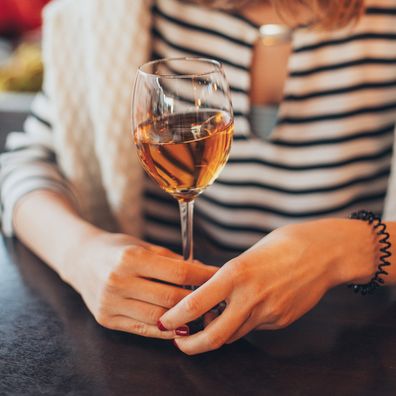 Stock image of woman drinking wine.