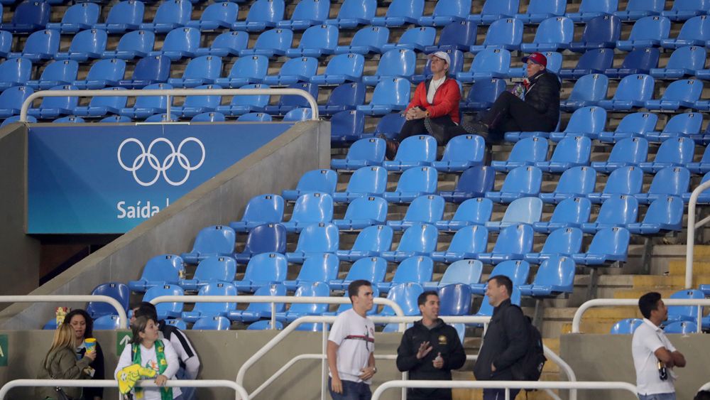 A few spectators sit in the stands at the Athletic, Track and Field events during the Rio Olympics. (AFP)