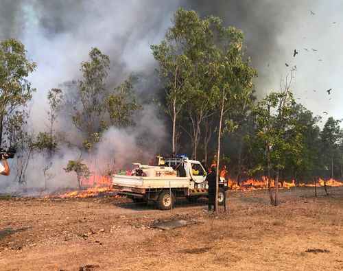 Three bushfires near Darwin have been reduced to Advice level after earlier threatening homes