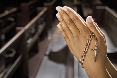 woman praying in catholic church