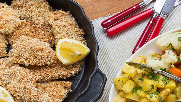 Crunchy fish with potato roasties, vegetables and tartare sauce