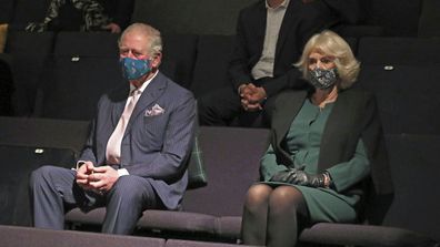 Prince Charles and Camilla, Duchess of Cornwall sit in the auditorium with Mayor of London, Sadiq Khan, top, to watch a short rehearsal performance at the Soho Theatre in London