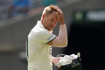 PERTH, AUSTRALIA - DECEMBER 16: David Warner of Australia looks dejected after being dismissed by Khurram Shahzad of Pakistan during day three of the Men&#x27;s First Test match between Australia and Pakistan at Optus Stadium on December 16, 2023 in Perth, Australia (Photo by Paul Kane/Getty Images)
