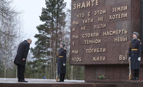 Russian President Vladimir Putin attends events marking the 80th anniversary of the break of Nazi's siege of Leningrad, (now St. Petersburg) during World War Two at the Piskaryovskoye Memorial Cemetery, where hundreds of thousands of siege victims are buried, in St. Petersburg, Russia, Wednesday, Jan. 18, 2023. 