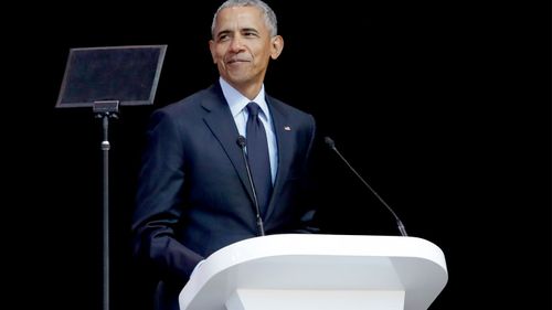Former US President Barack Obama delivers his speech at the 16th Annual Nelson Mandela Lecture at the Wanderers Stadium in Johannesburg, South Africa. (AAP)