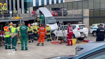 A woman has walked away uninjured after a tricky rescue operation in an Adelaide CBD car park.