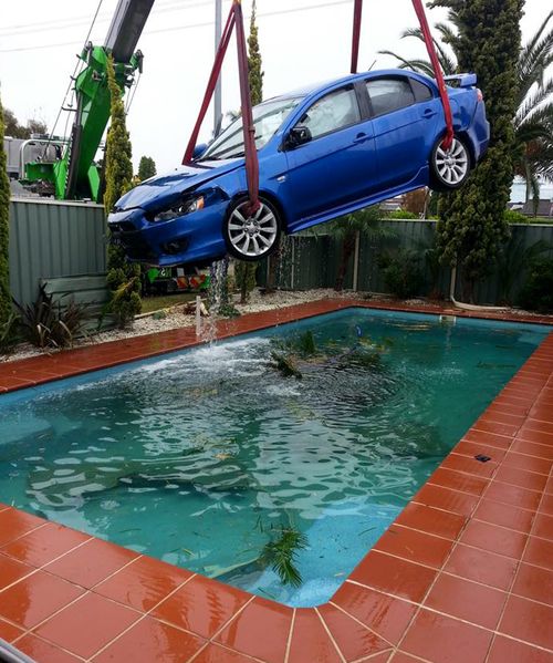 UPDATE: Taxi driver flees scene after collision sends sedan smashing through fence into backyard pool