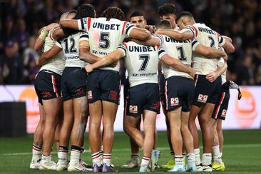 Roosters players huddle after a Storm try during the NRL Preliminary Final match between the Melbourne Storm and Sydney Roosters at AAMI Park on September 27, 2024 in Melbourne, Australia. (Photo by Cameron Spencer/Getty Images)