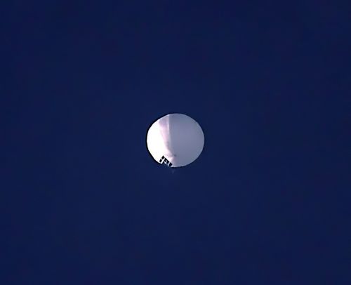 A precocious altitude balloon floats complete Billings, Mont., connected Wednesday, Feb. 1, 2023. 