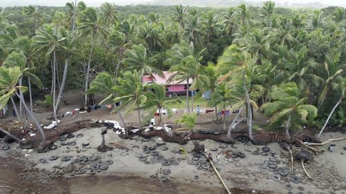 On a small stretch of beach an hour outside Fiji's capital Suva, the tiny village of Togoru is slowly slipping into the ocean.