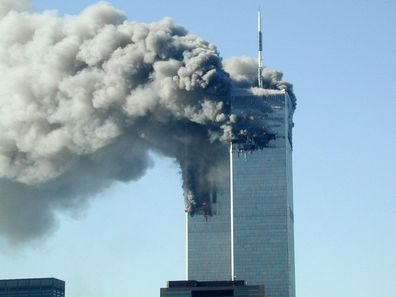 Smoke pours from the World Trade Center after being hit by two planes on the morning of September 11, 2001.