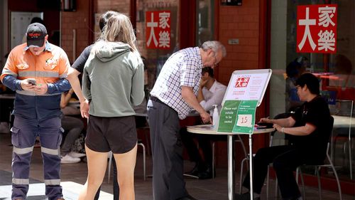 A QR code station outside a restaurant in Adelaide's Chinatown.