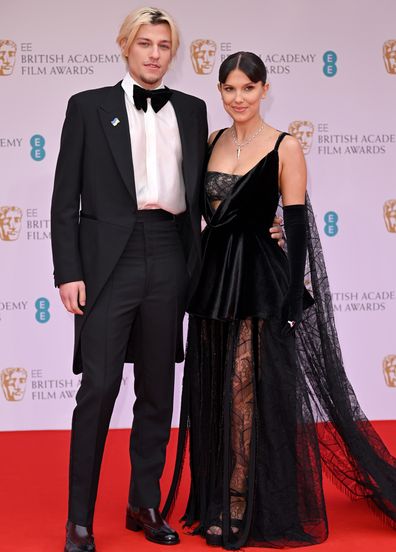 Jake Bongiovi and Millie Bobby Brown attend the EE British Academy Film Awards 2022 at Royal Albert Hall on March 13, 2022 in London, England. 