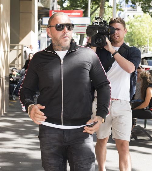 The former bikie was in court over allegations he punched a man and then stomped on his head outside a Southbank bar last year. (AAP)