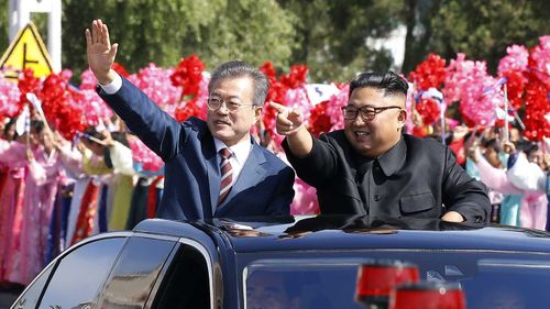 Moon Jae-in and Kim Jong-un during a welcome parade in Pyongyang, North Korea.