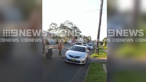 The bizarre road rage attack was captured on video on the Horsley Drive in Fairfield yesterday. (9NEWS)