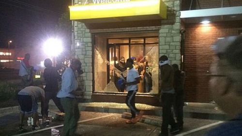 Looters smash a McDonald's window in Ferguson. (Source: Twitter, @thetechCEO)