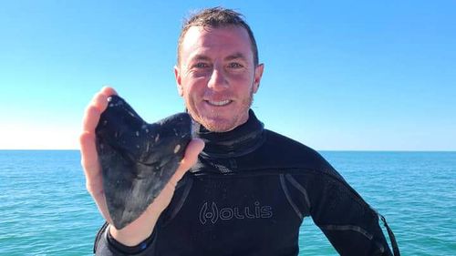 Florida diver finds giant megalodon shark tooth  at sea