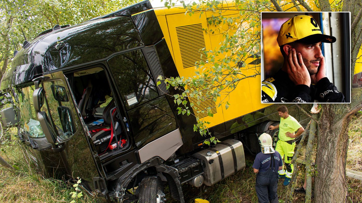 The damaged truck of the F1 Renault team is seen at the 121km section of the M1 motorway after it torn the half-barrier and fell into a ditch near Gyor, Hungary