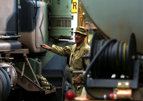 Corporal Justin Perry 4th Squadron 5ER is seen ahead of Australian Army Reserve and Regular personnel departing the Holsworthy Barracks to support bushfire efforts across NSW