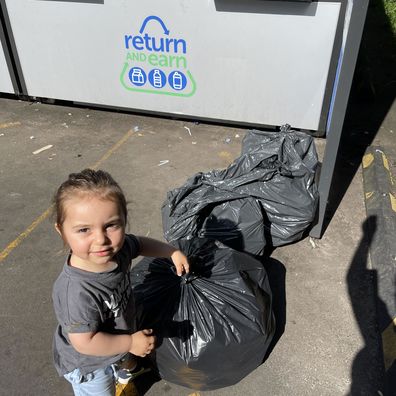 Two-year-old Noah excited to do his recycling. 