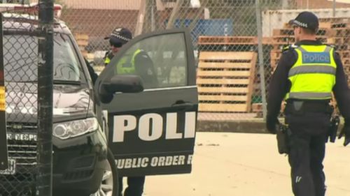 Fourteen men were arrested in the early-morning raids. (9NEWS)