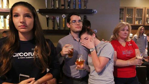 Tearful Marco Rubio supporters listen to his concession speech. (AAP)