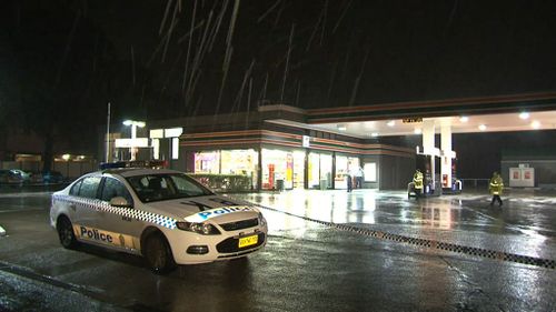 Two men wearing hoodies and armed with guns fled the Bankstown store with a small amount of cash. (9NEWS)