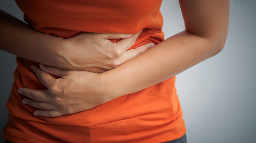 Woman with gastro / stomach pains