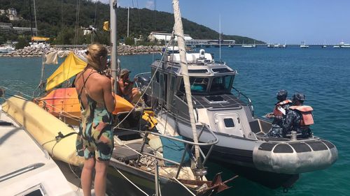 The crew are questioned by members of the Jamaican coast guard.