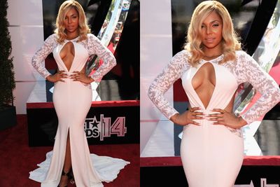 Boobs out for the boys! Ashanti flaunts her erm, assets in this cream-coloured Michael Costello gown.