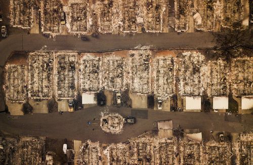 Residences leveled by the wildfire line a neighborhood in Paradise.