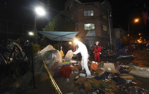 Emergency services at the site of the explosion. (AP)