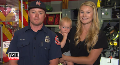 Firefighter Zachary Petite with his wife and youngest son who he rescued from drowning 