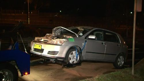 A car crashed into a police vehicle in Sydney. (9NEWS)