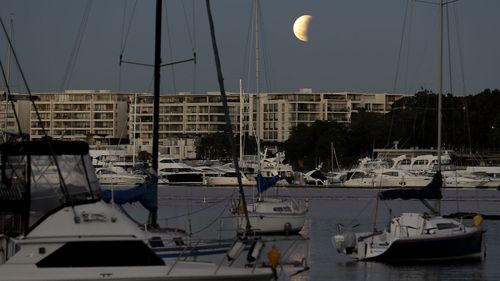 The partial lunar eclipse above Sydney.