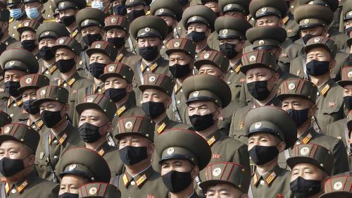 Aoldiers wearing face masks to help curb the spread of the coronavirus rally to welcome the 8th Congress of the Workers' Party of Korea at Kim Il Sung Square in Pyongyang.