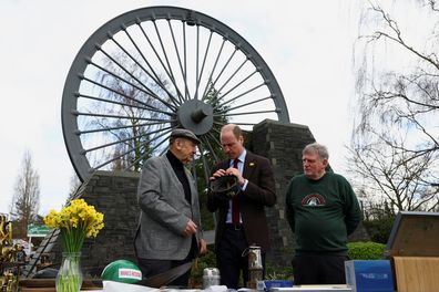 Prince William, Prince Of Wales is accompanied by Alan Jones chairman of Gresford disaster memorial and George Powell, lead volunteer at the Wrexham Miners Project, during a visit to the Gresford Colliery Disaster memorial on March 1, 2024 in Wrexham, Wales.  