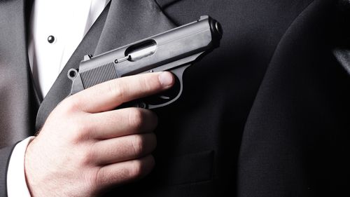 British spy James Bond 007 gun tuxedo